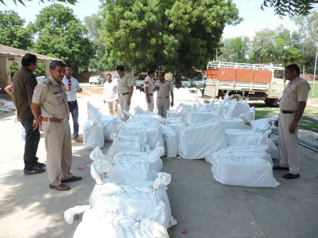 Haryana police personnel guard items seized from Dera headquarters on Saturday