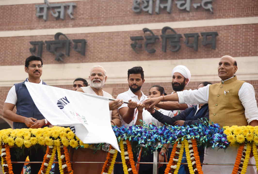Prime Minister Narendra Modi, home minister Rajnath Singh, minister of state for youth affairs and sports Rajyavardhan Singh Rathore flagging off the Run For Unity from the Major Dhyan Chand National Stadium. Phot credit: PIB