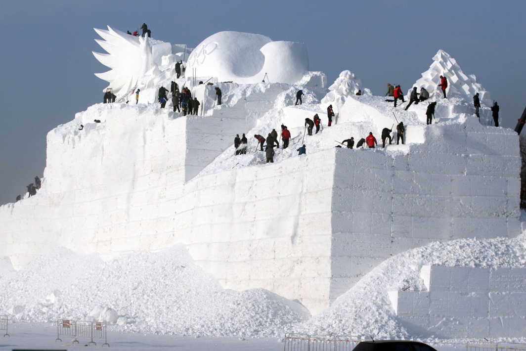 WORK OF PASSION: People prepare a snow sculpture for the Harbin Sun Island International Snow Sculpture Art Expo in Harbin, Heilongjiang province, China, Reuters/UNI