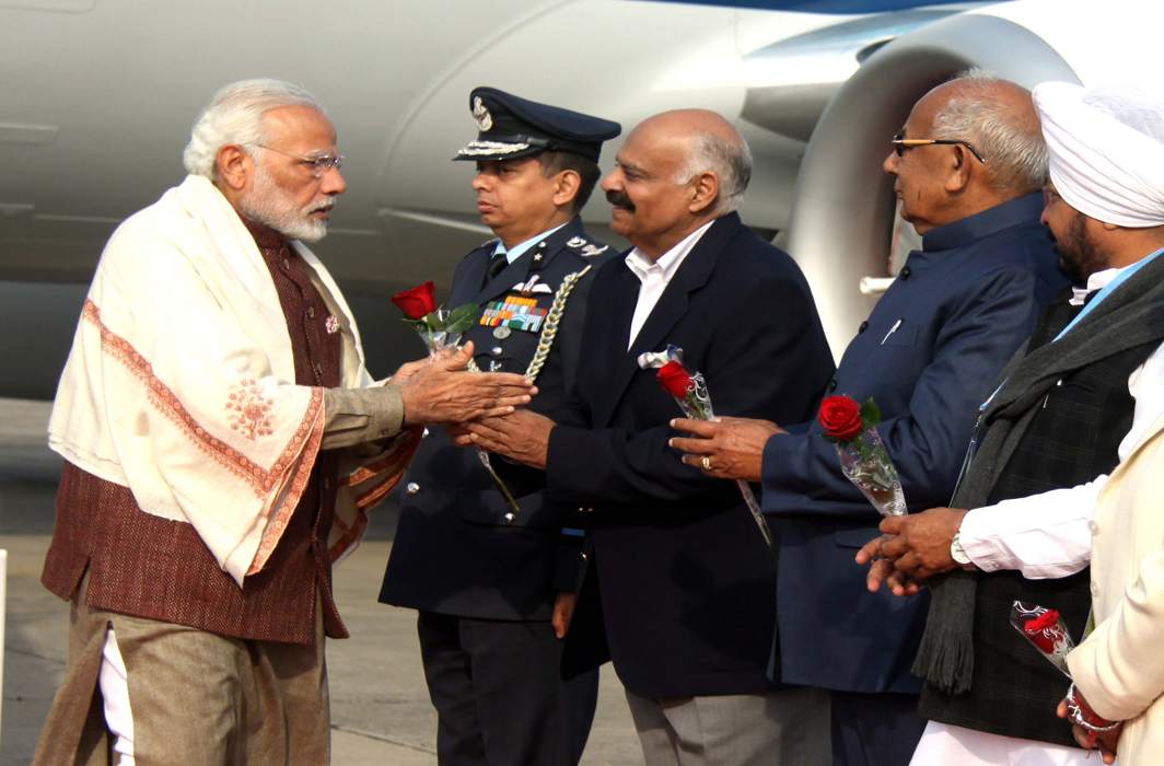 BON VOYAGE: Prime Minister Narendra Modi being received by the Governor of Punjab and Administrator, Union Territory, Chandigarh, VP Singh Badnore, at Chandigarh airport on way to Shimla, UNI
