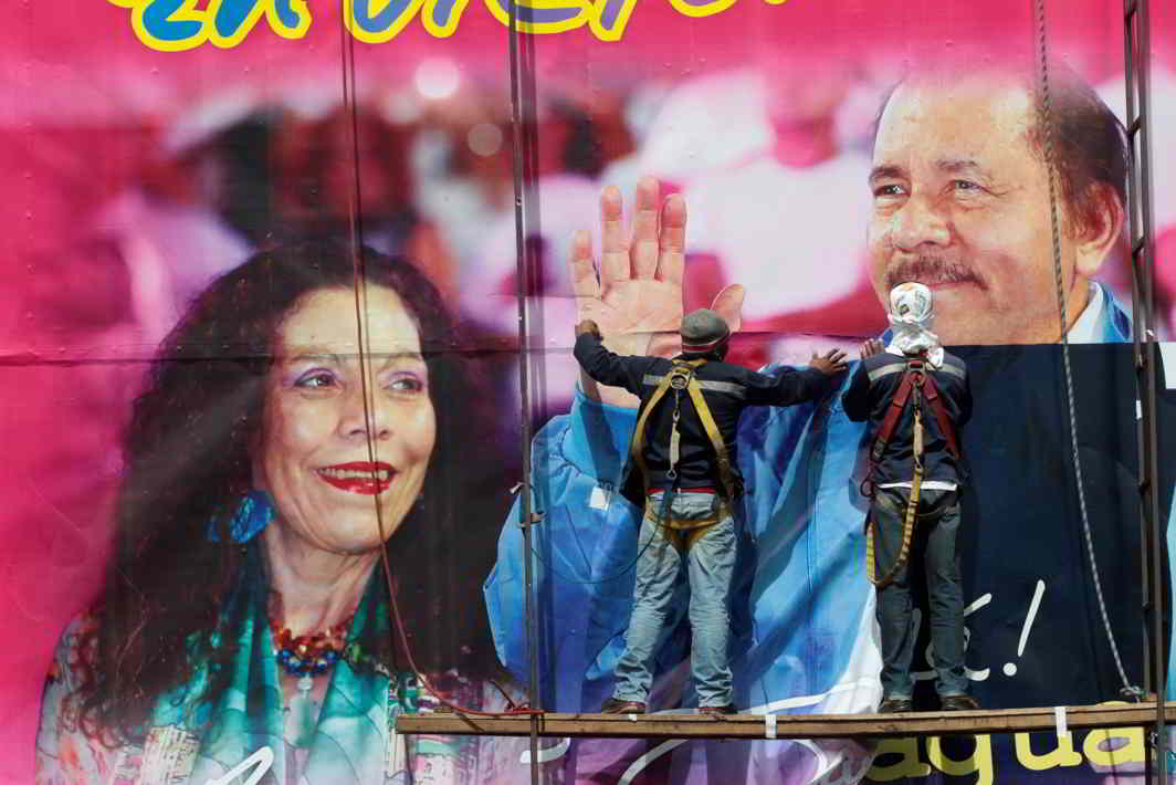 FIRST FAMILY: Workers put up a billboard with the image of Nicaragua's President Daniel Ortega and Vice-President and First Lady Rosario Murillo in Managua, Nicaragua, Reuters/UNI