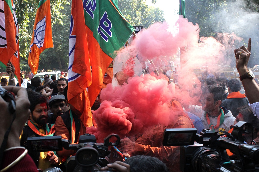 SAFFRON RAGE: BJP workers celebrate their party's victory in the Gujarat and Himachal Pradesh assembly elections at the BJP headquarters in New Delhi, UNI