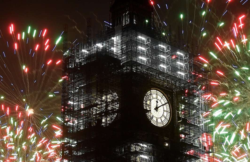 CINDERELLA HOUR: Fireworks explode behind Elizabeth Tower, commonly known as Big Ben, during New Year's Eve celebrations in London, Britain, Reuters/UNI