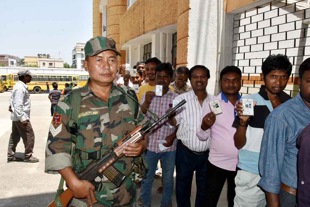 A security personal stands guard at a polling station during Ranchi municipality elections in Ranchi, Jharkhand, UNI