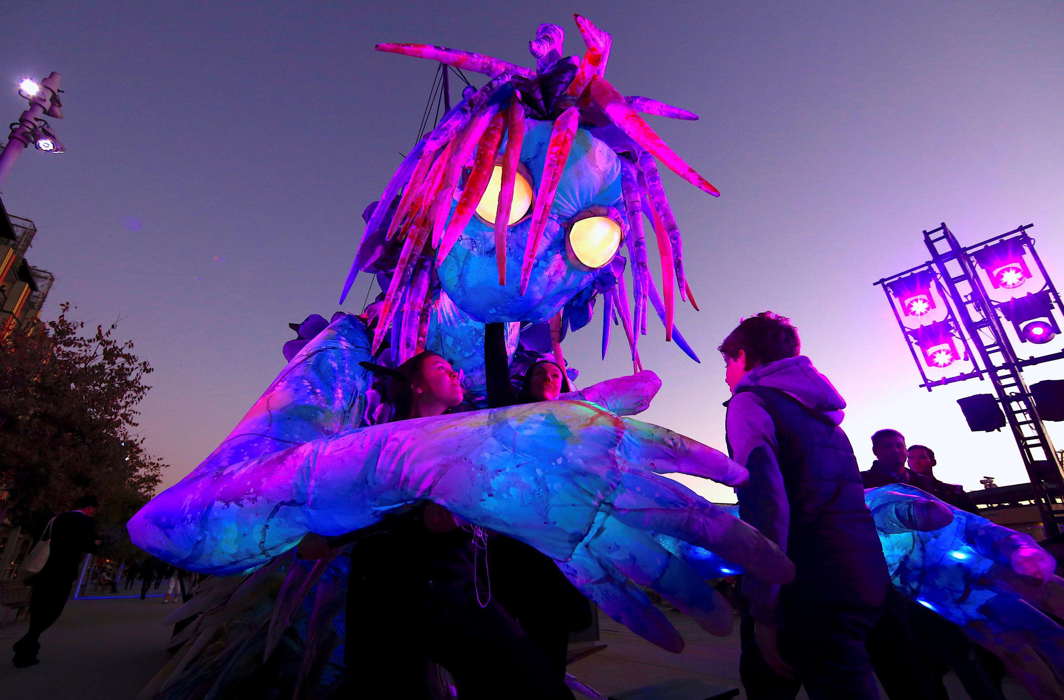 A boy looks at a six-metre tall luminescent puppet, operated by ten performers, during a preview of Vivid Sydney, promoted as the world’s largest festival of light, music and ideas, in Sydney. The festival will run for 23 days, starting on May 25, Reuters/UNI
