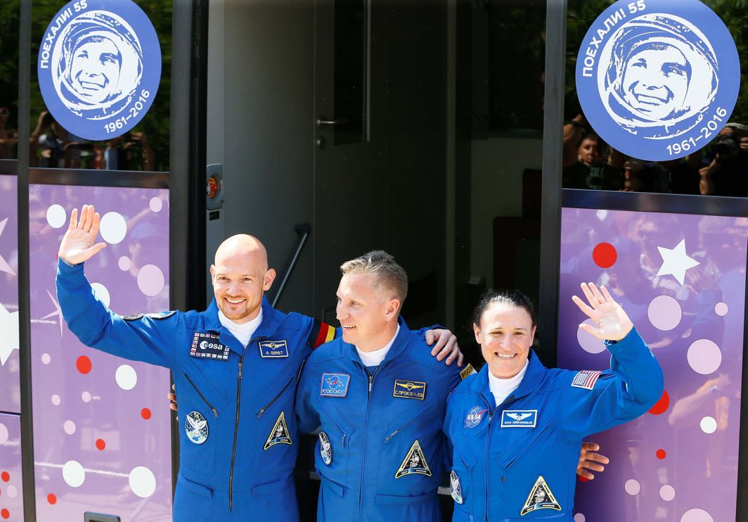 The International Space Station (ISS) crew members Serena Aunon-Chancellor of the US, Alexander Gerst of Germany and Sergey Prokopyev of Russia wave in front of a bus before leaving for a pre-launch preparation at the Baikonur Cosmodrome, Kazakhstan, Reuters/UNI