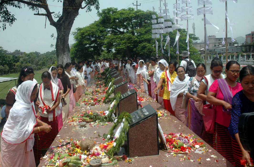 People pay homage to the 23 martyrs, on the 17th anniversary of the Great June Uprising Unity Day, at the memorial site in Kekrupat near Kangla Fort in Imphal, UNI