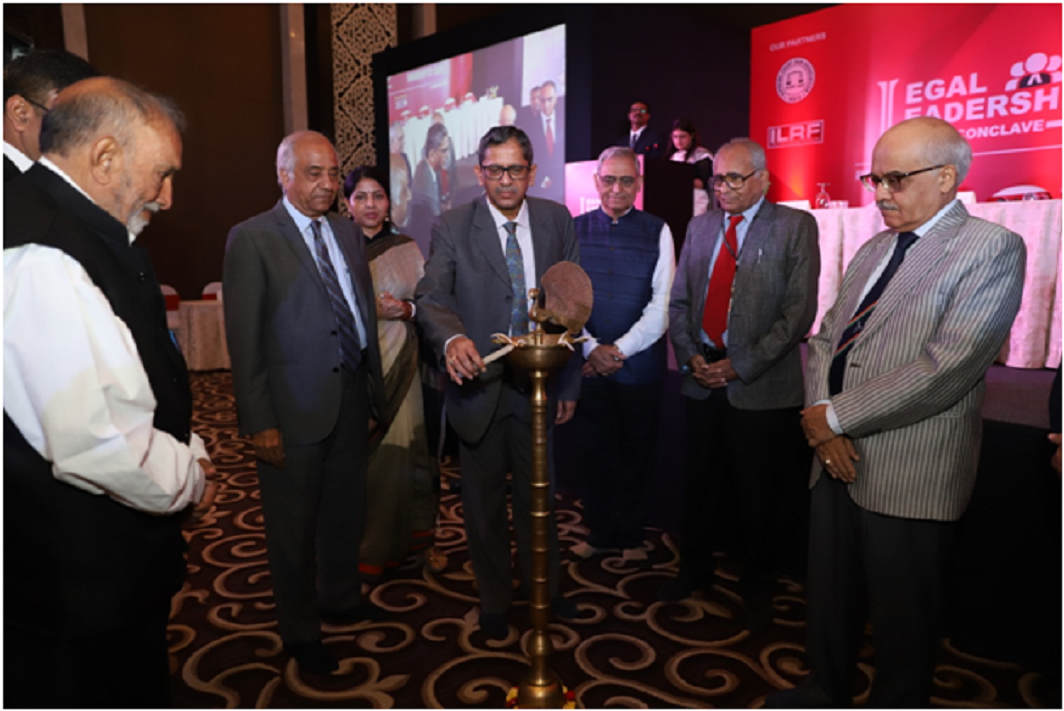 Justice NV Ramana lighting the lamp. Also seen are MD, APN News Rajshri Rai (standing behind him) and Editor-in-Chief India legal Inderjit Badhwar (second from right).
