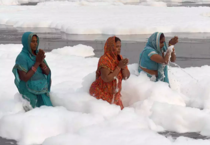 devotees take a dip in river Yamuna
