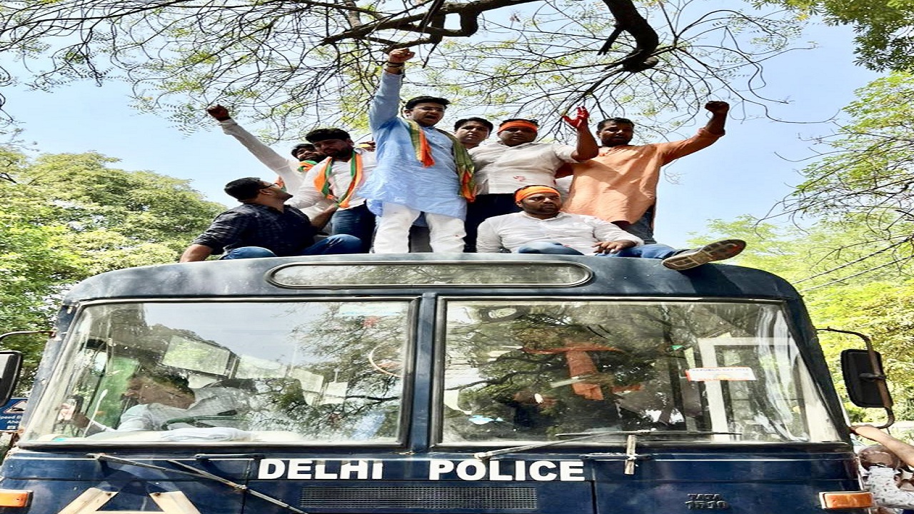 Tejasvi Surya atop police vehicle outside Delhi CM Arvind Kejriwal's residence
