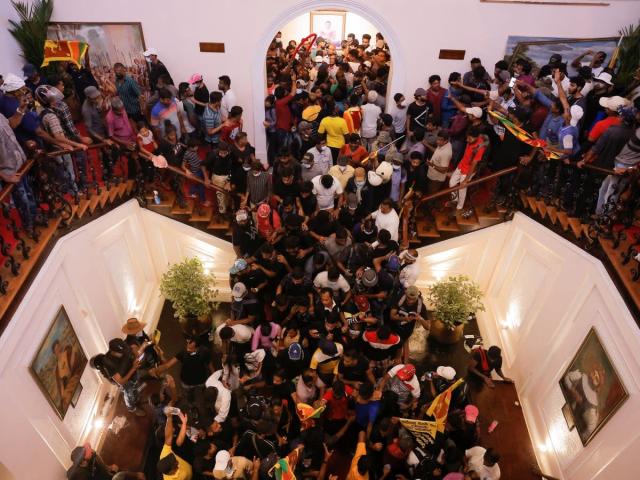 Sri Lanka crisis: Protesters storm Presidential palace, barge into kitchen, pool, turn PM's bed into WWE wrestling ring | See pics and videos