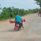 son carrying mother’s dead body on bike