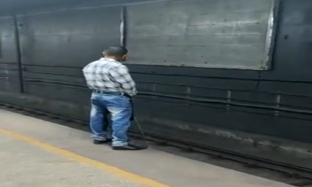 A man urinating at Malviya Nagar metro station