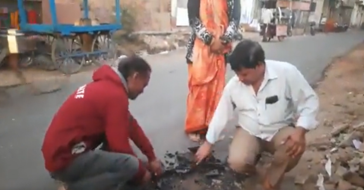 Agra men rip road