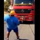 Man pulling truck with his teeth