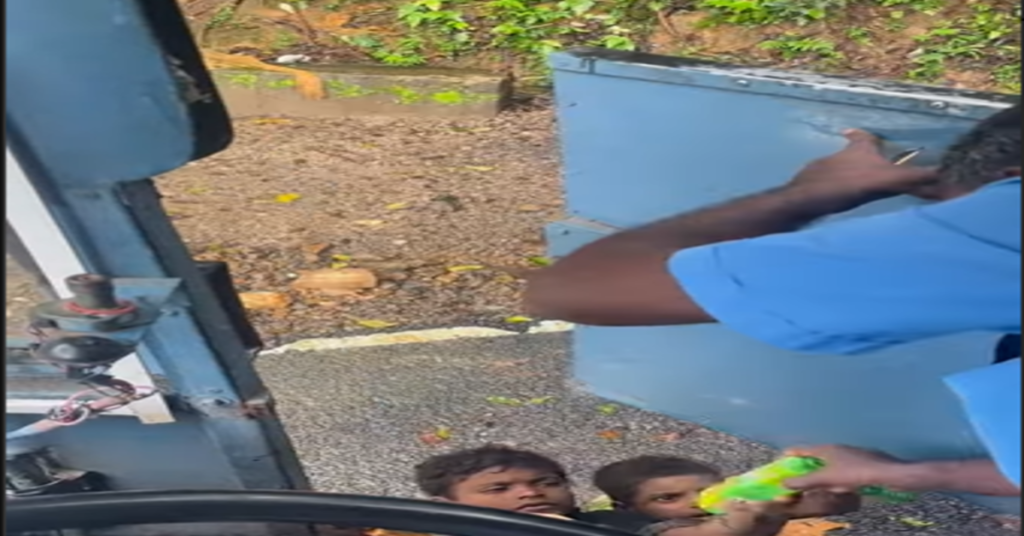 bus driver giving food to children