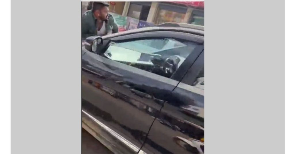 woman dragged a man on her car's bonnet