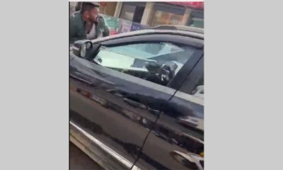woman dragged a man on her car's bonnet