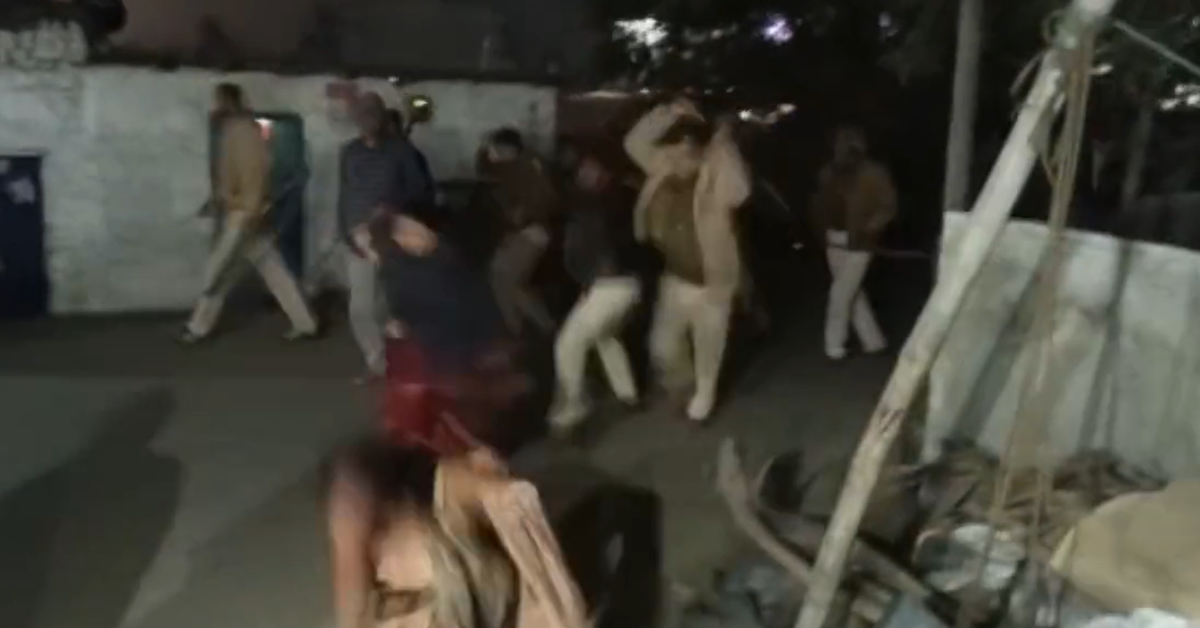 police beating up women with sticks in Bihar