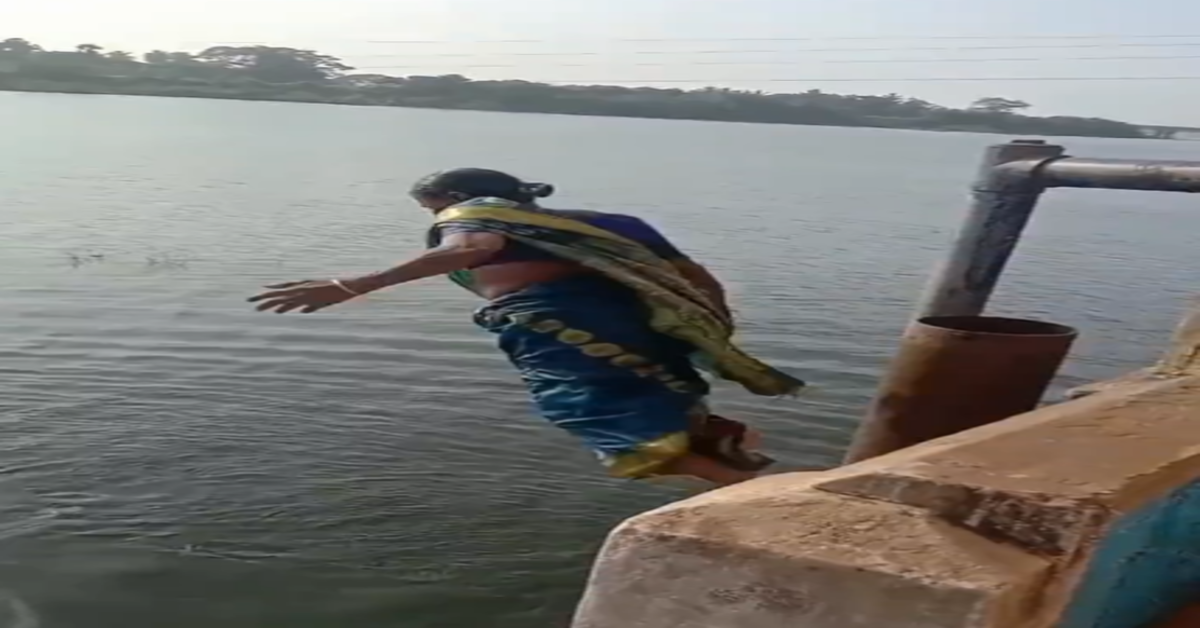 saree clad women diving into Tamil Nadu river