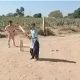 Village girl playing cricket