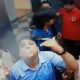 men drinking, smoking inside lift