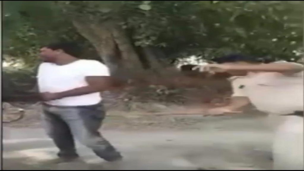 Police officer thrashes man