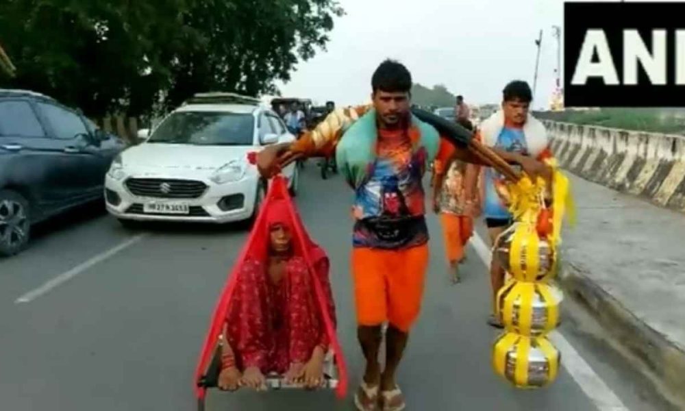 Watch: Devotee carries mother on shoulder during Kanwar Yatra